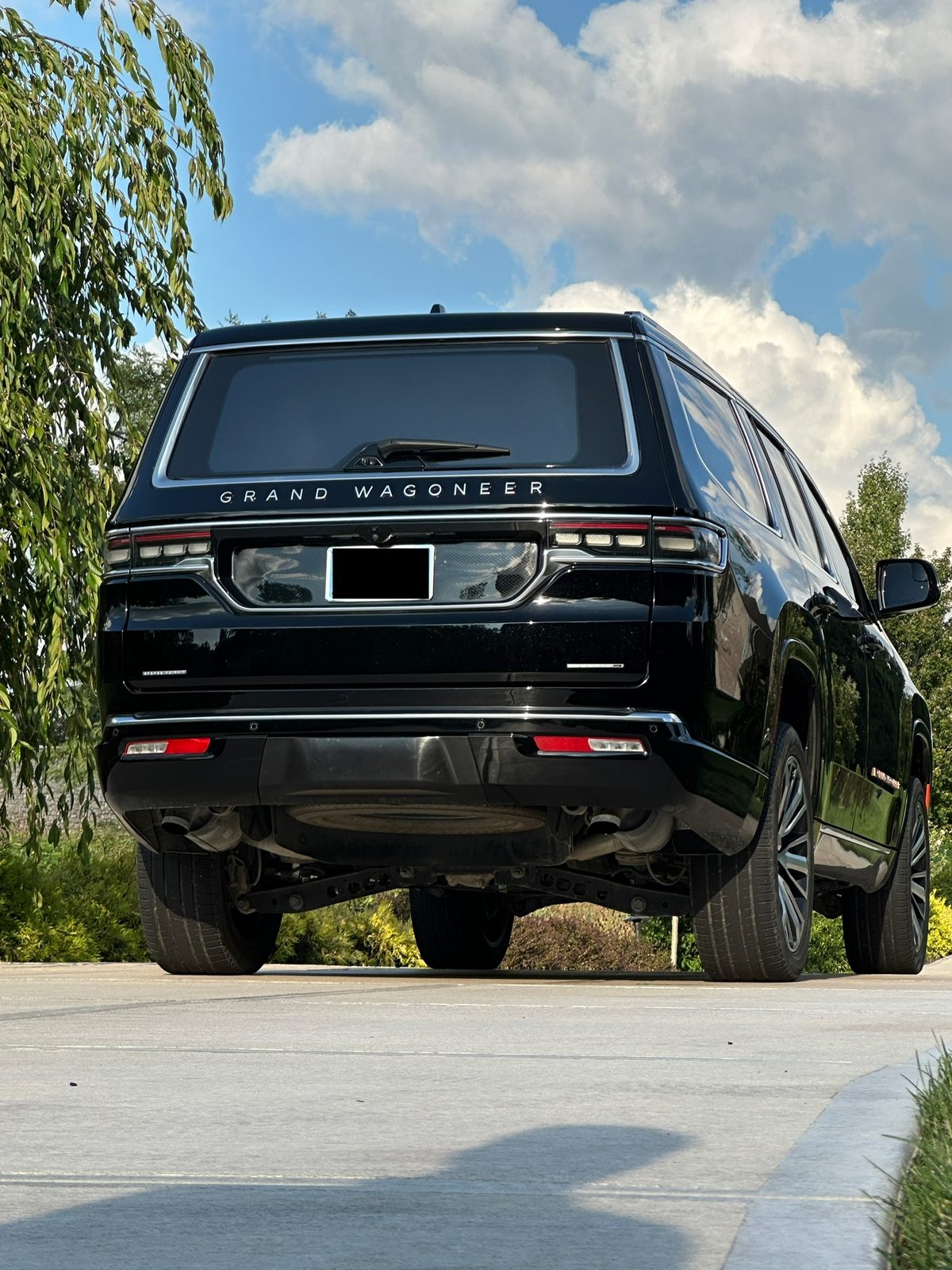 Rear three-quarter view showing gloss ceramic-coated paint